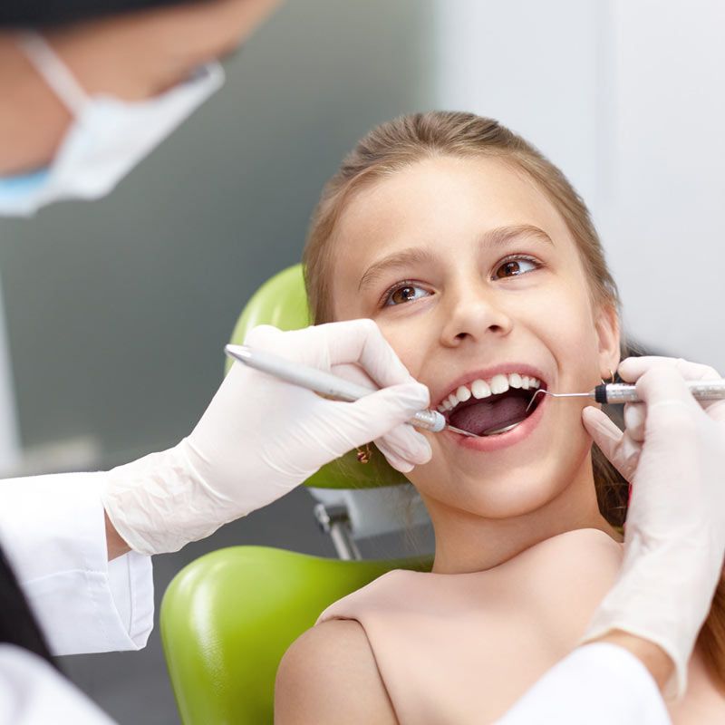 Dentist Workin on Childs Teeth 2 Dentist Working on Childs Teeth 2